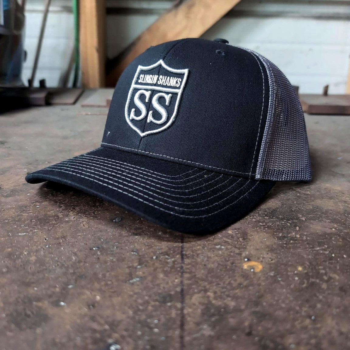 Slingin Shanks SS Shield trucker hat charcoal angle